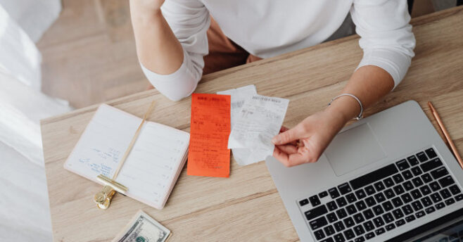 Lady holding receipts