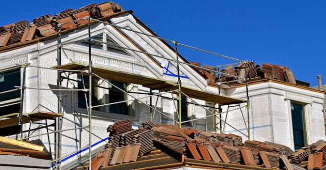 Roofing contractor working on a roof