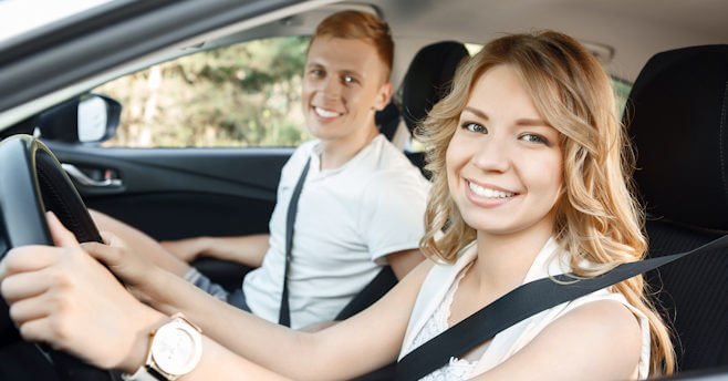 Young couple in their car